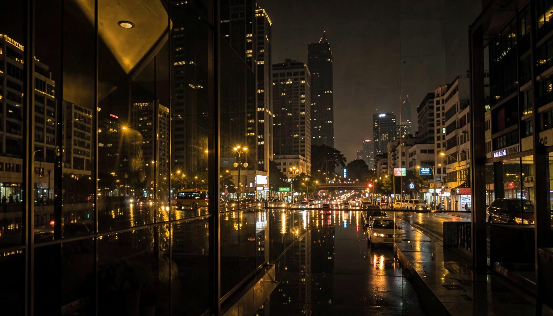 Elegant evening scene in Mumbai, warm golden city lights reflecting off glass and polished surfaces, deep charcoal and gold tones